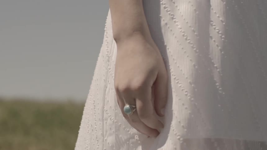A person wearing a ring outside
