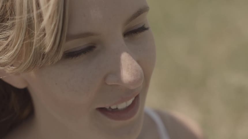 A woman with her eyes closed