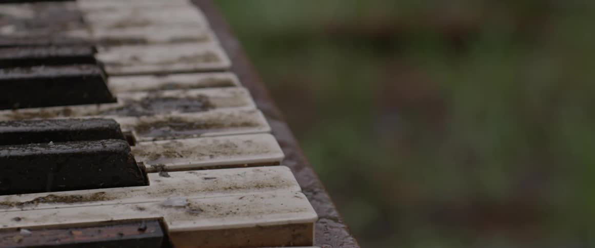 A piano sitting outside