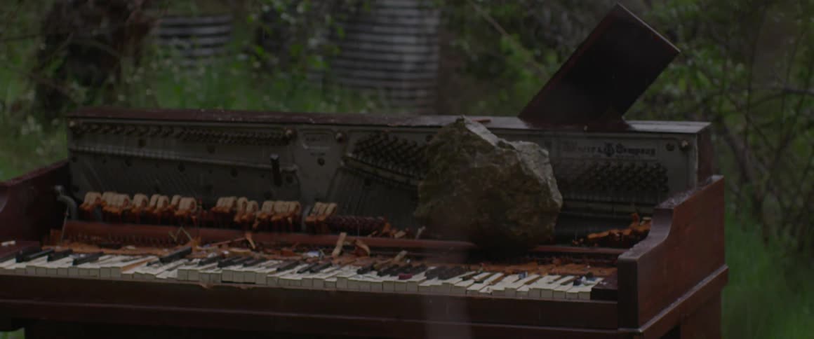 A piano sitting outside