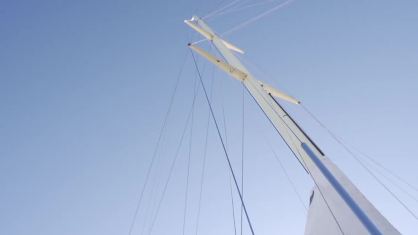 A boat mast against a clear sky