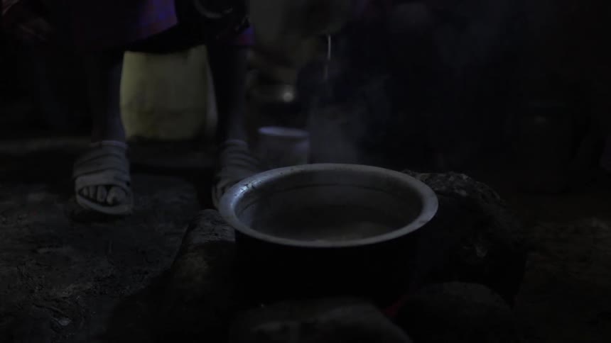 A person mixing hot liquid