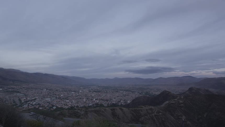 Clouds float over a valley