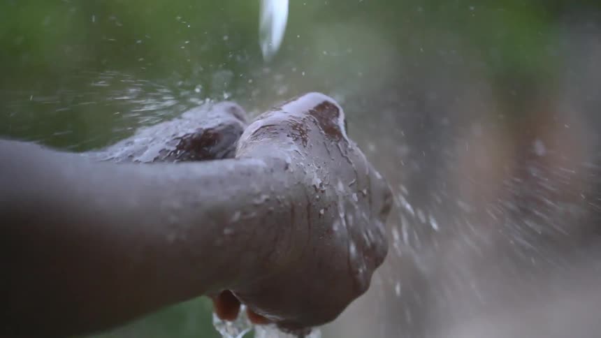 A person washing their hands