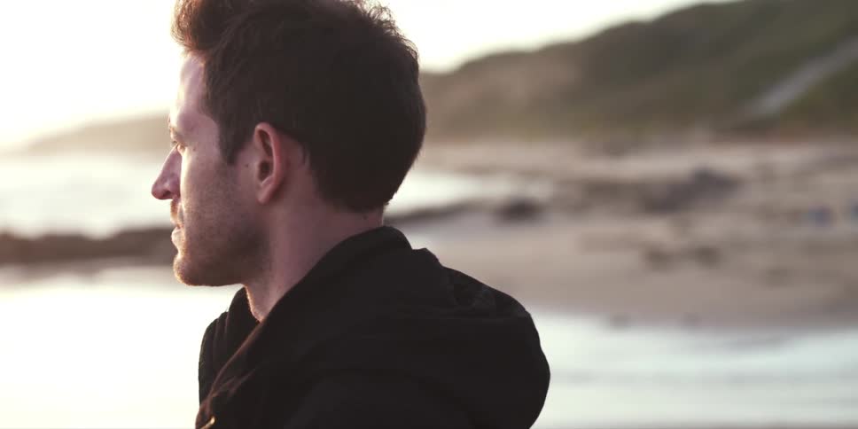 A person looking  out at the ocean