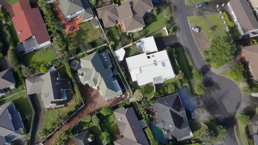 An aerial view looking down on large homes in a neighborhood