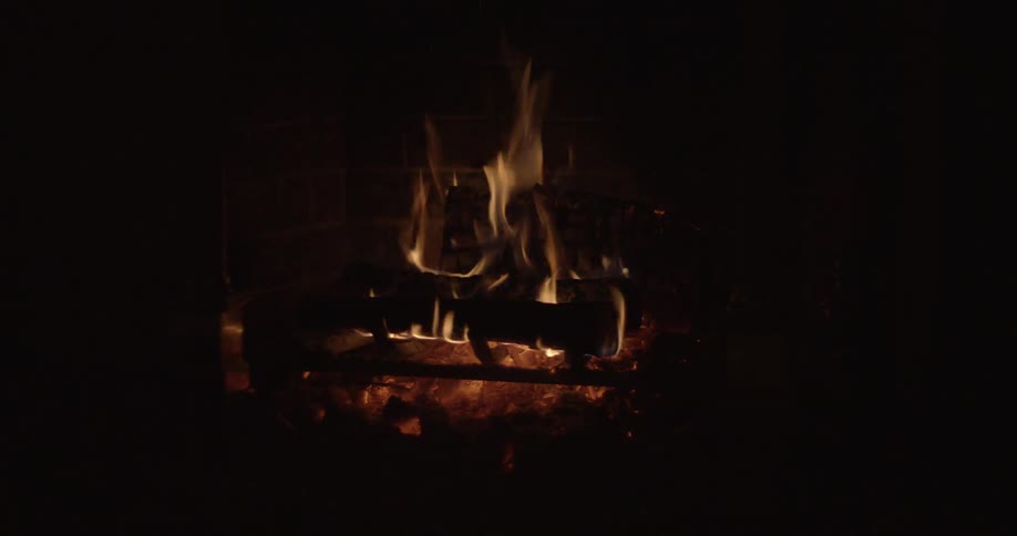 A fire is burning in a fireplace