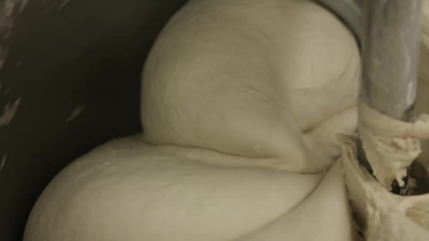 Dough is kneaded in a stand mixer