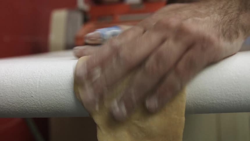 Dough is laid flat and run on a conveyor belt