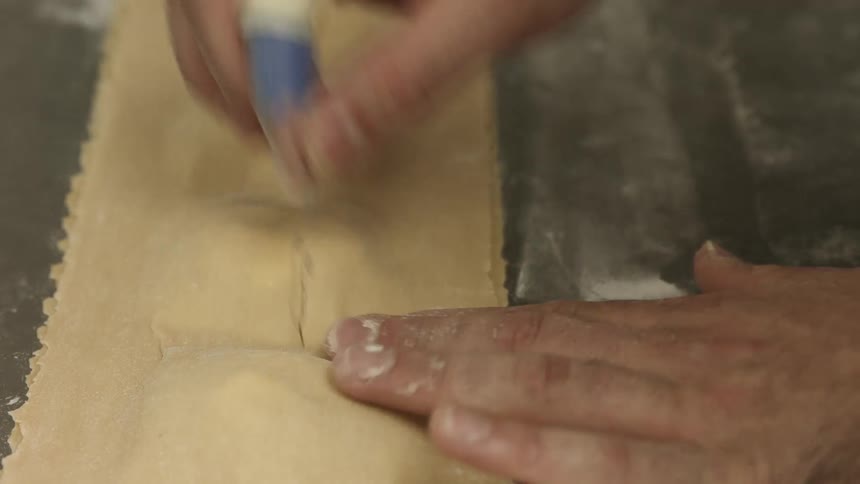 A person making pasta