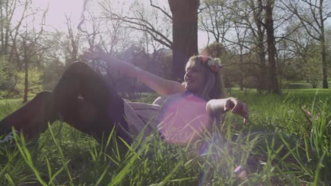 A person laying down in the grass