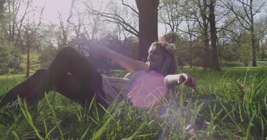 A person laying down in the grass