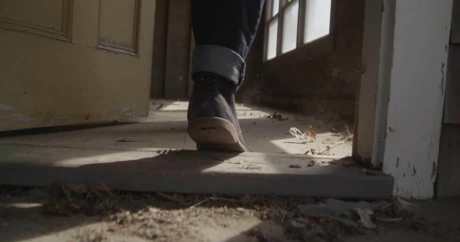 A person walking thru a doorway