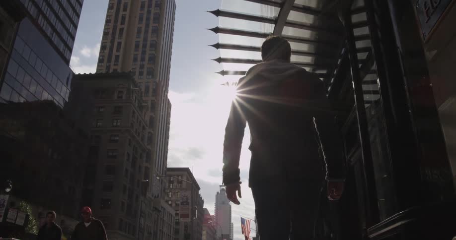People walking down  city street
