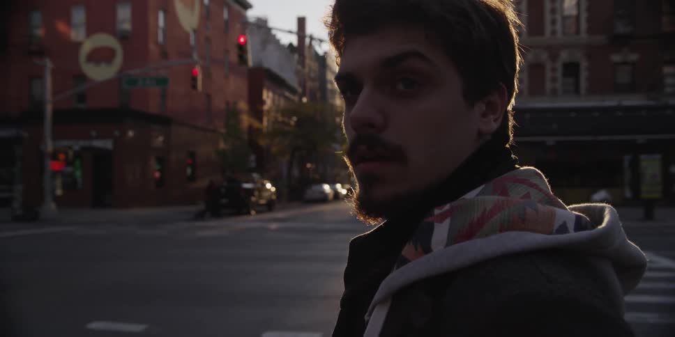 A person standing on a street corner