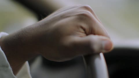 A person driving a car