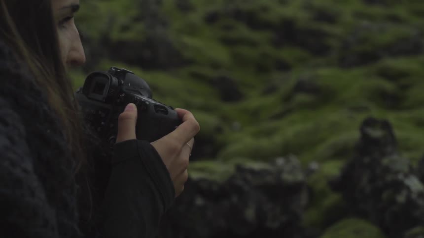 A person taking pictures of nature