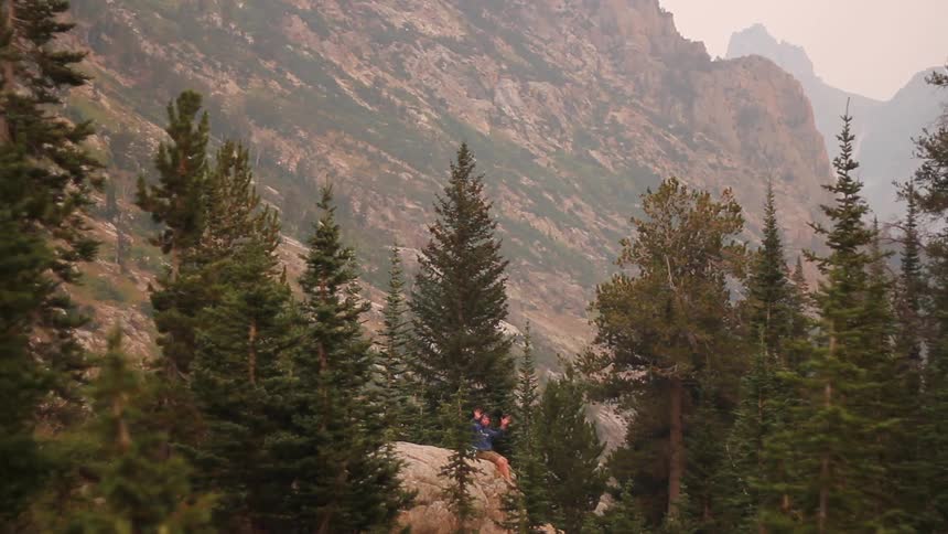 A person waving in the distance