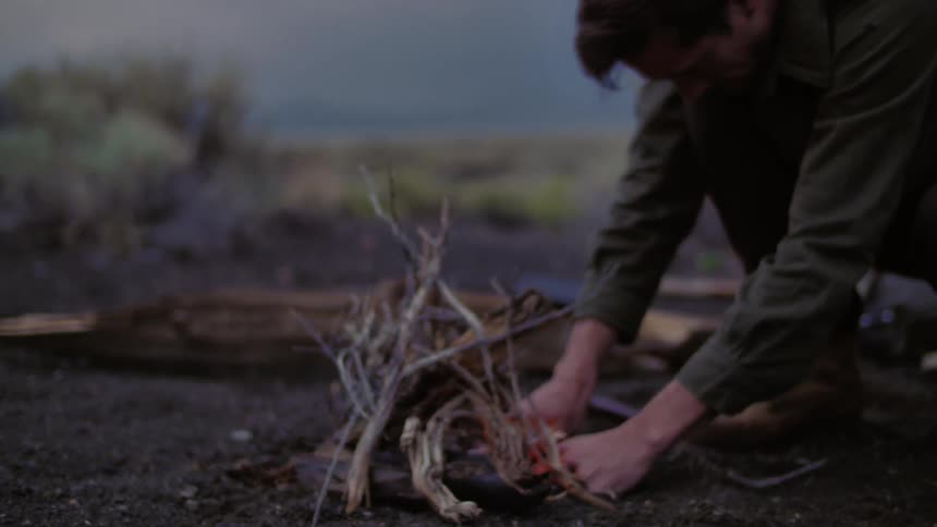 A person making a fire