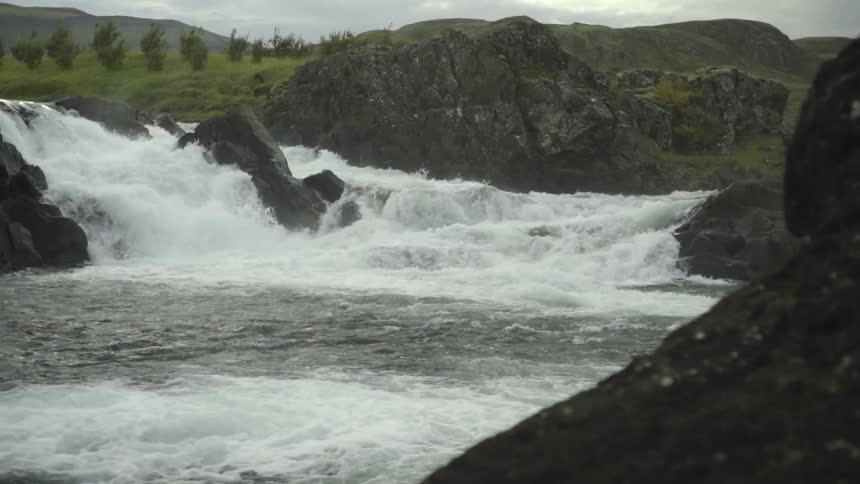 Water rushing over rocks in a rushing river
