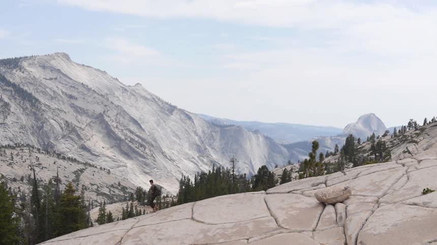 A hiker descends a mountain