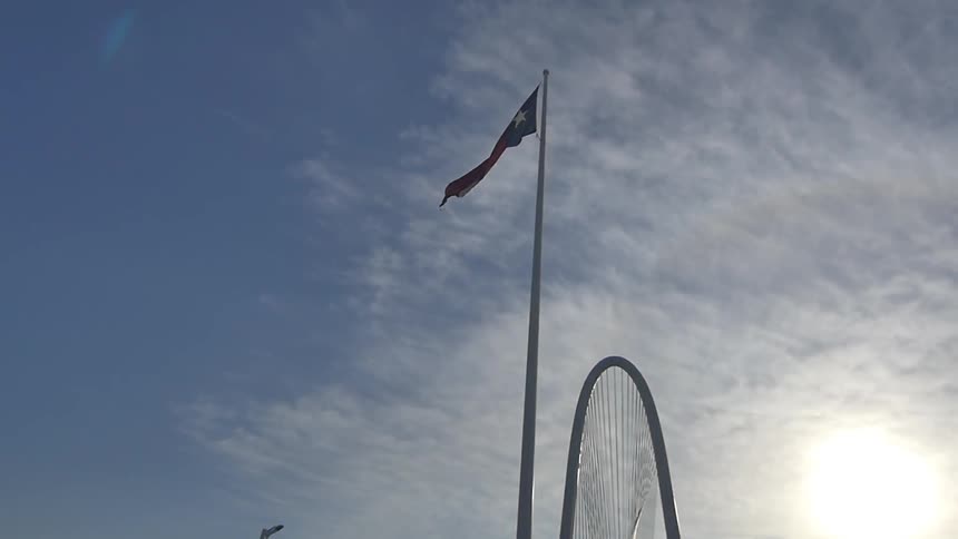 A flag is shown near a bridge
