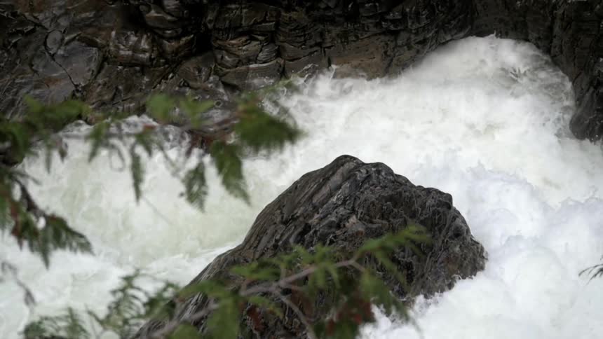 Water crashes against rocks