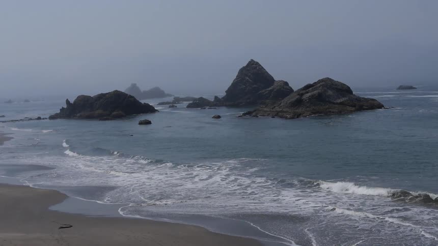 Rock outcroppings in ocean near beach