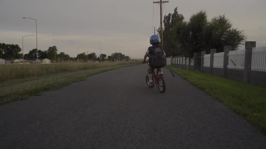 A child ride a bicycle