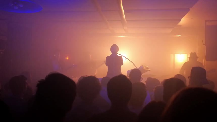 A band plays to an audience