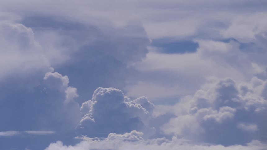 Giant white clouds in a blue sky