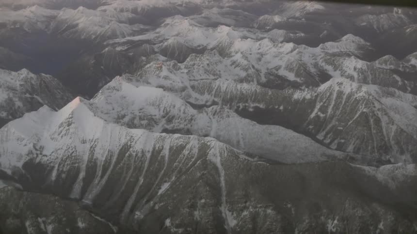 Snow covered mountains loom in the distance
