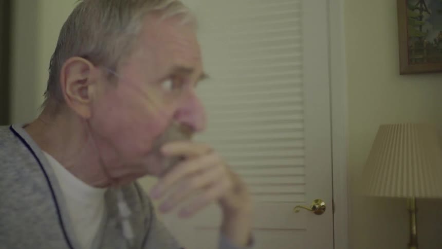 A man hooked up to oxygen talks