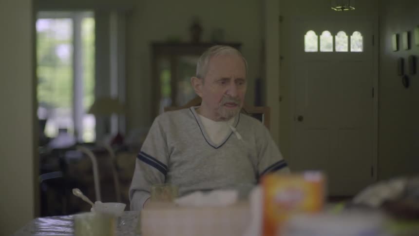 A man sits at a table