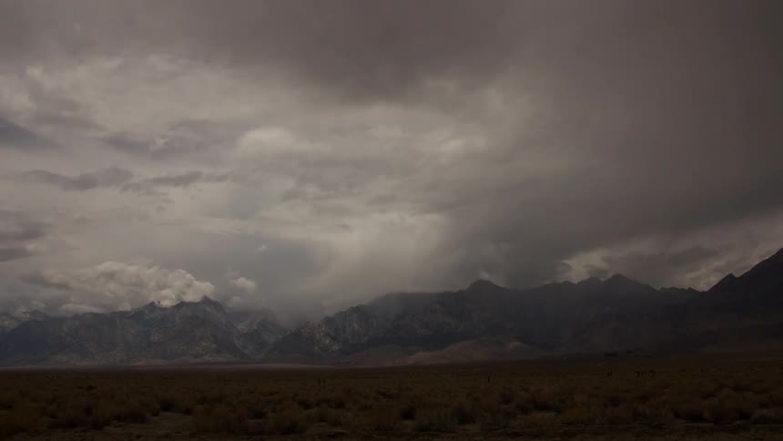 A storm rolls in over the mountains