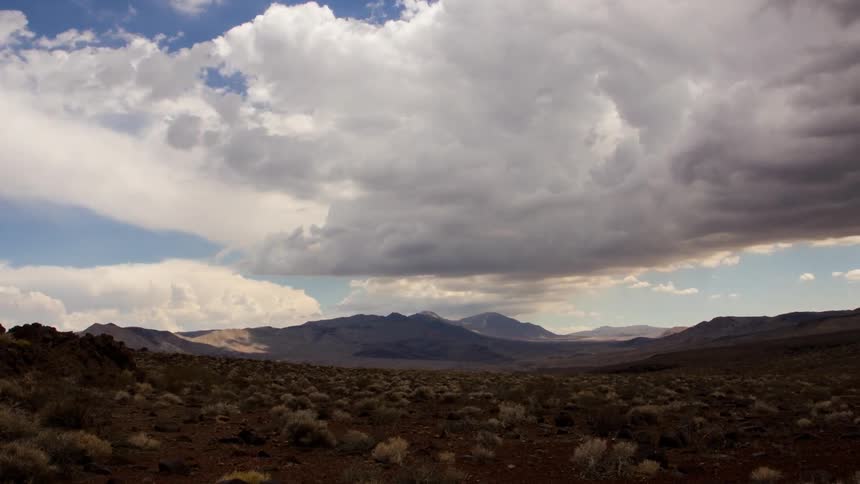 Clouds float over a desert