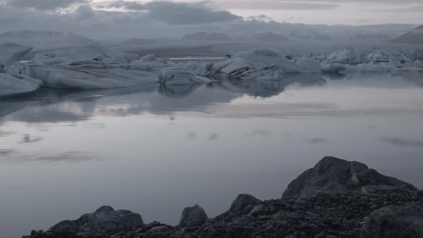 A frozen landscape lies just past a pond