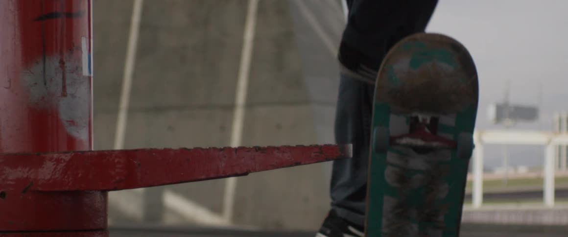 Man doing a grind trick on a skateboard