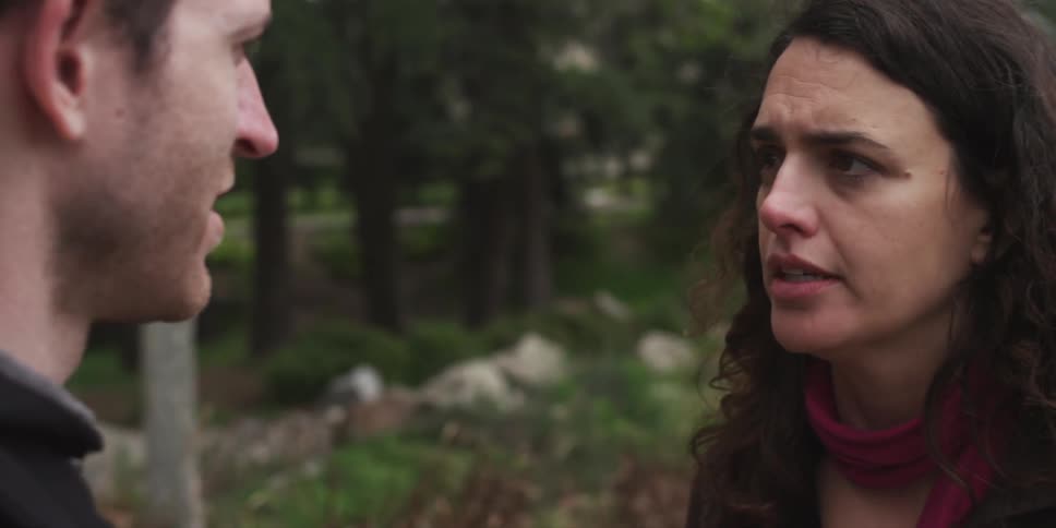 A couple is arguing in a field