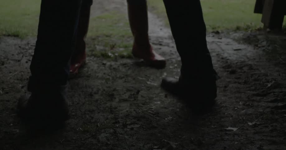Couple's lower legs dancing in rhythm with each other