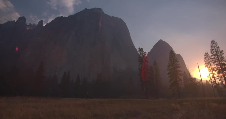 A mountain looms over a field