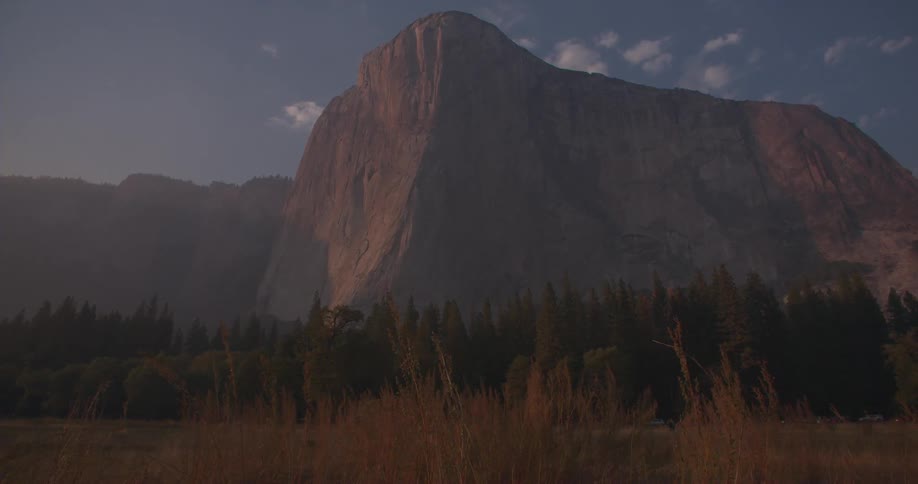 A mountain looms over a valley