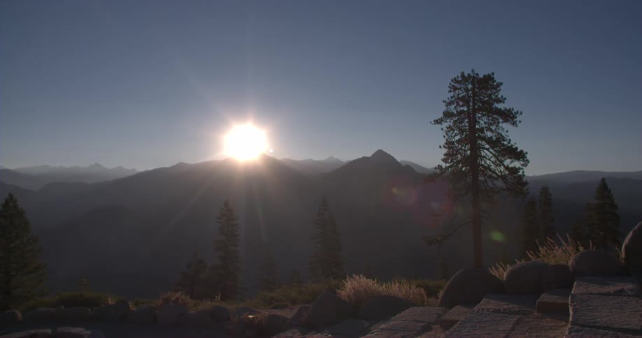 The sun shines over the mountains