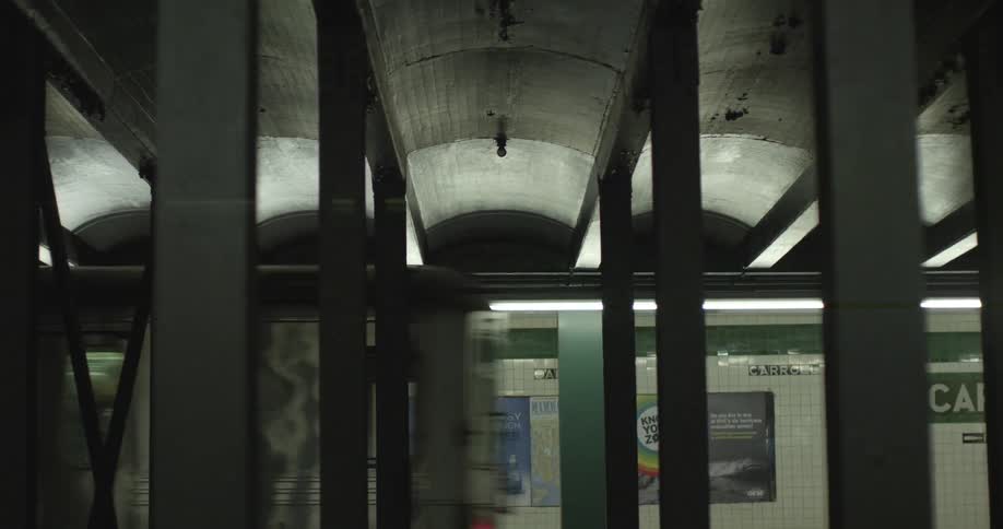 People watching subway train move by