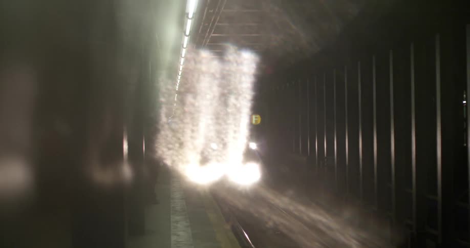 Subway car pulling into a station