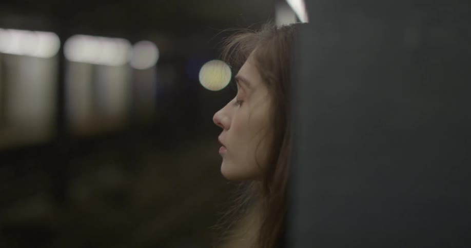 A person waiting at a train station