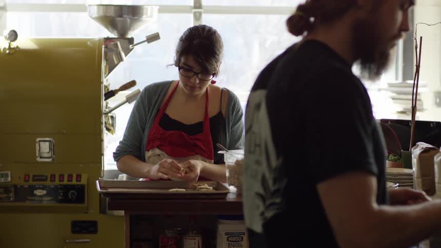 Employee makes food for the business