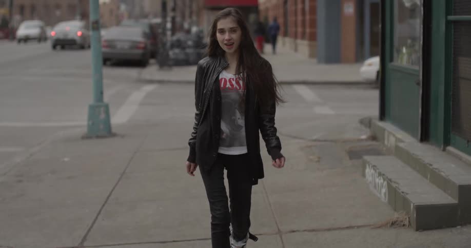 A woman is walking down the street