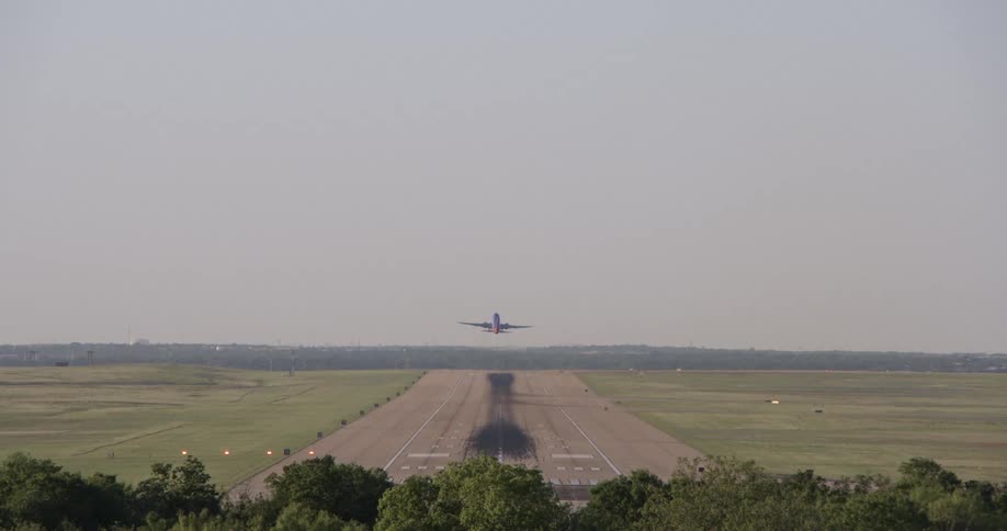 A plane takes off from a runway