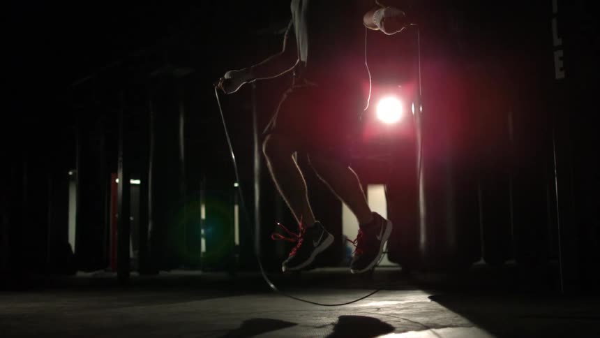 A man jump ropes